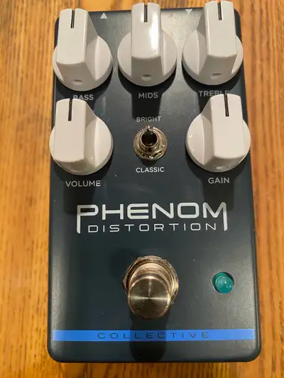 Awesome Wampler Phenom Distortion pedal. Has controls for Bass, Mids, Treble, Volume, and Gain. Also...