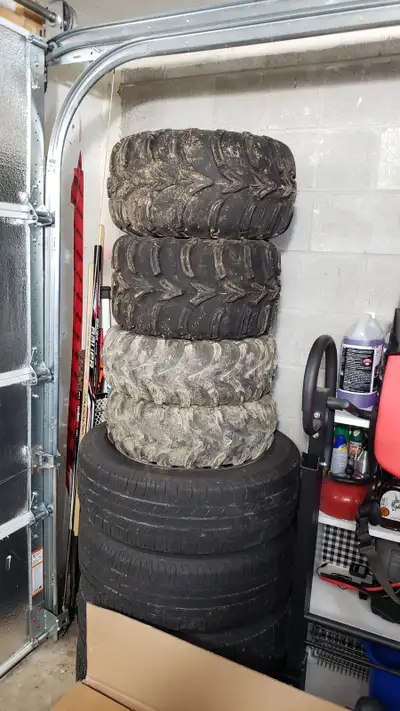 Polaris 400 tires on rims. Rears are in good shape. Fronts are worn. Rims are worth the money alone....