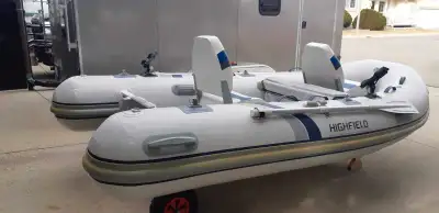 Selling an inflatable rigid boat with a brand new electric motor (used only one time). Boat: Highfie...
