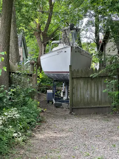 Sailboat and trailer. Solid and seaworthy with wheeled helm, electric power, and trailer. 1981 Mirag...