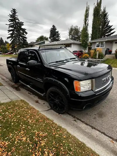 AWD 6.2 Denali No issues other than a traction light Call 403-4024737