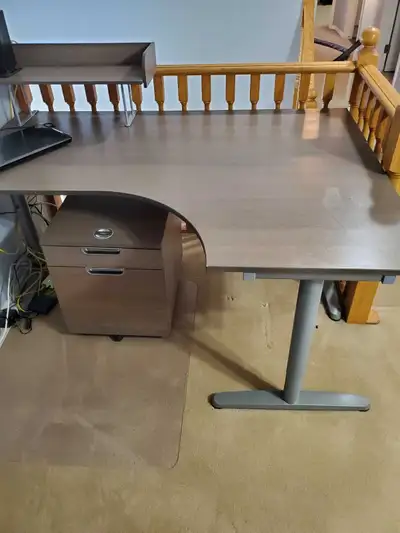 Solid desk with small shelf and filing cabinet. Very sturdy. Very good shape.