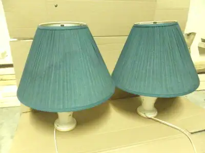 Selling a pair of beautiful antique lamp in very good condition. 23" high & comes the shades which a...