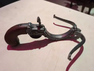 This used antique pistol, with its distinctive design and ornate detailing, would make a fascinating...