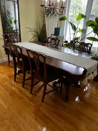 Solid wood dining table and 5 hand carved chairs 