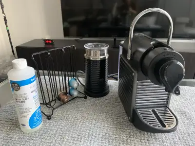 Brew the perfect espresso at home with this Nespresso Essenza Mini, a compact machine that doesn't c...