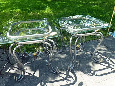 Pair of metal and glass coffee end tables measuring 19 inches wide, 19 inches deep, and 19 inches ta...