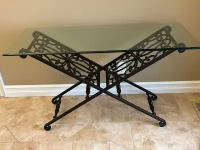 Glass top and wrought iron base. Gently used. Shows some wear as seen in photo.
