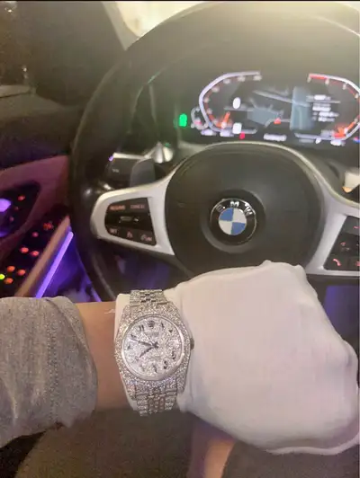 Selling a brand new fully iced moissanite watch with a clean Arabic numeral dial. The entire watch i...