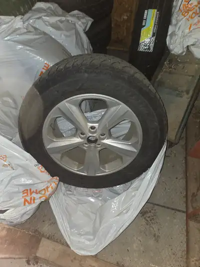 I have 4 rims and studded tires off a Ford Edge, size 245/60R18 - Goodyear Ultragrip. Kept indoor in...