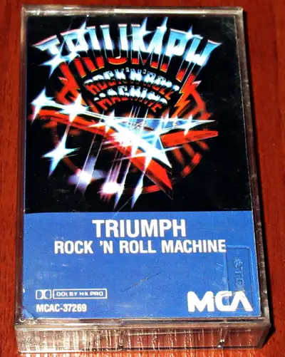 Cassette Tape :: Triumph - Rock 'N' Roll Machine $10 Dollars A1 Takes Time A2 Bringing It On Home A3...