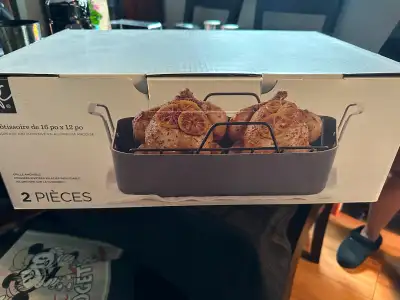 2 piece Roasting pan. Only used once. Stock top safe, stainless steel handles, and removable rack.