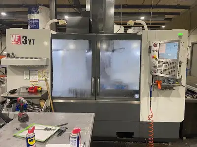 2010 HAAS VF-3YT Specifications X-Axis 40" Y-Axis 26" Z-Axis 25" Table Size 52" x 23" Spindle Speed...