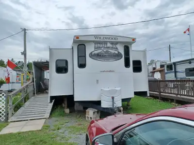 For sale a 40ft wildwood 3 sidle park model flt with building and deck.location is at little lake ca...