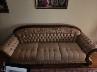 Beautiful three piece couch with wood trim 