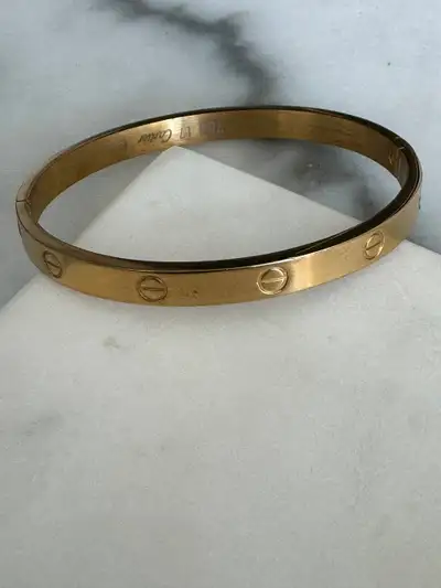 Elevate your style with this exquisite high-quality replica of the iconic Cartier Love Bracelet. Cra...