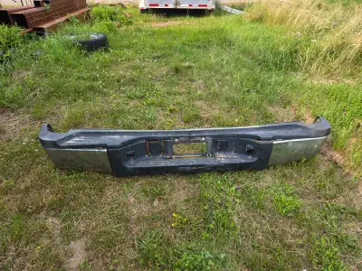 This is a bumper from a 2013 GMC 2500 truck. Although it has some wear, it's a solid replacement par...