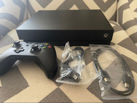 Xbox one x 1TB (Almost new) (Delivery available)