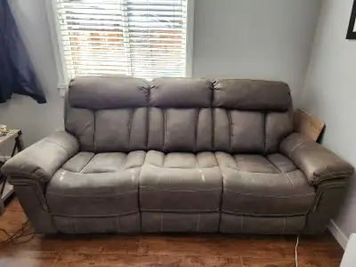 Three seater Grey leather couch. Im fantastic condition. Moving across the country and it has to go.