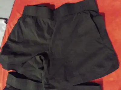 2 pairs of Tuff Athletics shirts with pockets. Fits size XL. In great condition from non smoking hom...