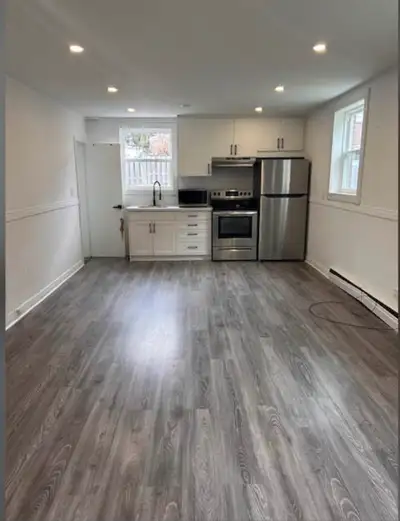 BACHELOR APARTMENT INCLUDES ALL UTILITIES, PARKING, STORAGE