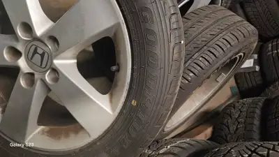 Up for sale are a set of used Honda rims with Good ride tires, size 205/55R16 91 VThese rims and tir...