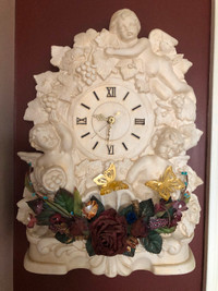 Beautiful ceramic clock.  Table top or hanging.
