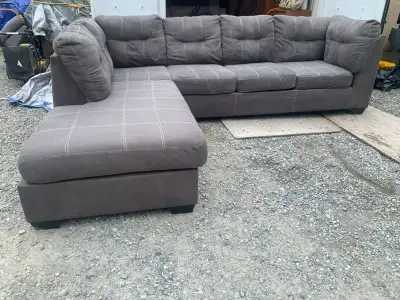 Large grey sectional sofa in good condition, been shampooed. Normal wear n tear with use . 115 x 88...
