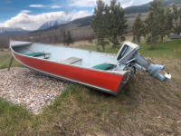 12 ft. aluminum boat and 8 hp. Evinrude outboard motor.