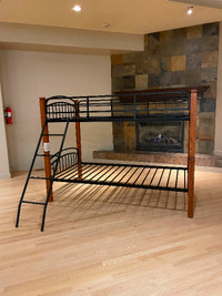 Used like new hardwood with metal twin size bunk bed