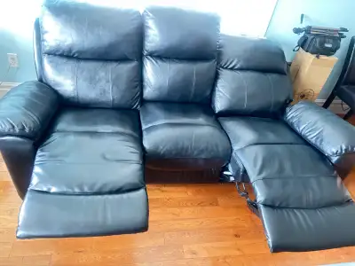 This comfy leather couch has two recliners and is perfect for lounging! It's gently used, but still...