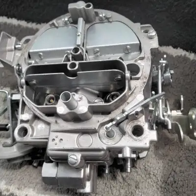 SELLING A SLIP USED 4 BARREL CARBURETOR IT HAS BEEN TRIED ON A VIECHEL PROBABLY DIDN'T FIT IT LOOKS...