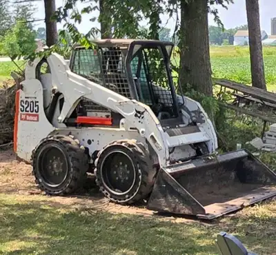 2008 Bobcat s205. Roughly 2300 hours. Good shape. Heated cab with door. Solid rubber tires. Needs ne...