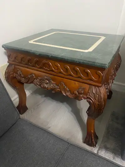 Genuine marble stone top with solid heavy wood. Coffee table with 2 end tables. The coffee table’s m...