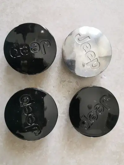 Jeeps cap only have one black and one Chrome caps left 55 mm dia outside each cap 12 $