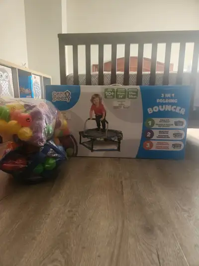 Trampoline and ball pit. Comes with lots of balls. Trampoline has a removable bar.
