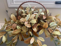 Golden fake silk foliage plant in basket