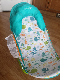 Child bath seat....used once or twice NEW CONDITION