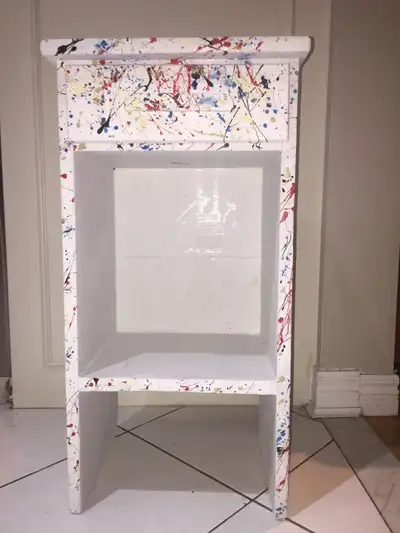 Solid wood side table, small shelving piece Painted white with mix of splatter paint colours - black...