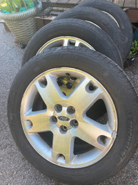 18 inch ford rims with tires on. The tires have a season left.