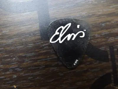Elvis Presley "Guitar Pick" I have for sale an Elvis Presley "Guitar Pick" The pick is black and fea...