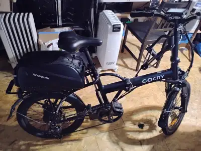 Go City foldable electric bike with silicone reinforced u-bar tire lock, bike lock, mounted storage...