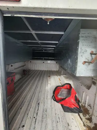 8' Aluminum truck cap. Built in side boxes. Double door at back measures to 49" wide fully open. Has...