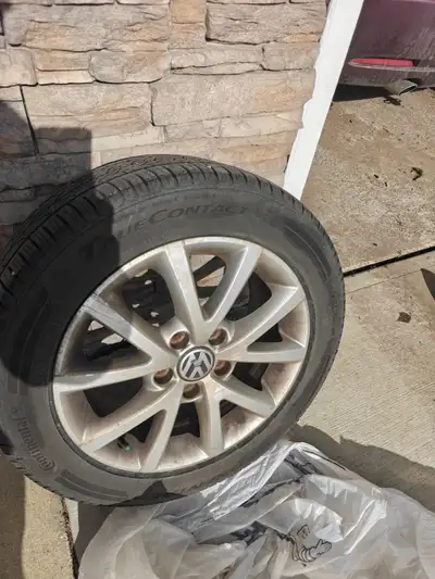 Set of 4 Continental tires (205 /55 R 16 91 H) on VW OEM rims. Tires were used for one summer season...
