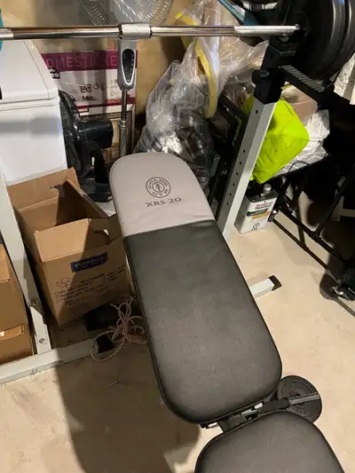 Get ready to pump some iron with this used Gold's Gym XRS 20 Olympic workout bench, complete with we...
