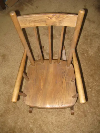 Child's wooden rocking chair, View more