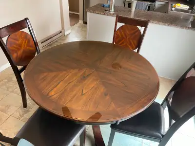 Solid wood Round table on a unique pedestal . 6 chairs and sideboard cupboard! Custom made glass top...