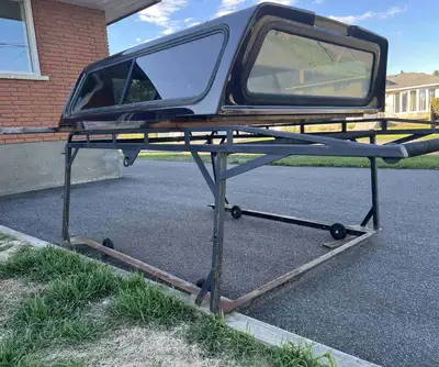 I'm selling a boat/construction rack and Leer topper that's in great condition, ready to be mounted...