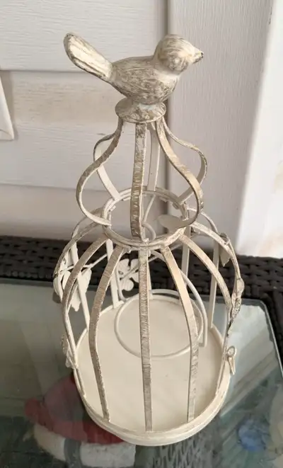This is for a beautiful metal off white and gold birdcage lantern with a bird on top. It has a flora...
