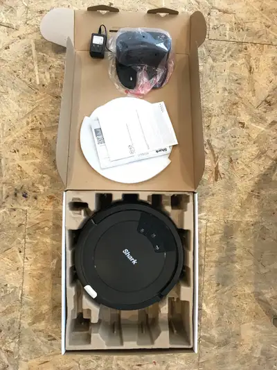 Shark automatic vacuum. Working and in good condition. Cleans your floors and returns to charging st...